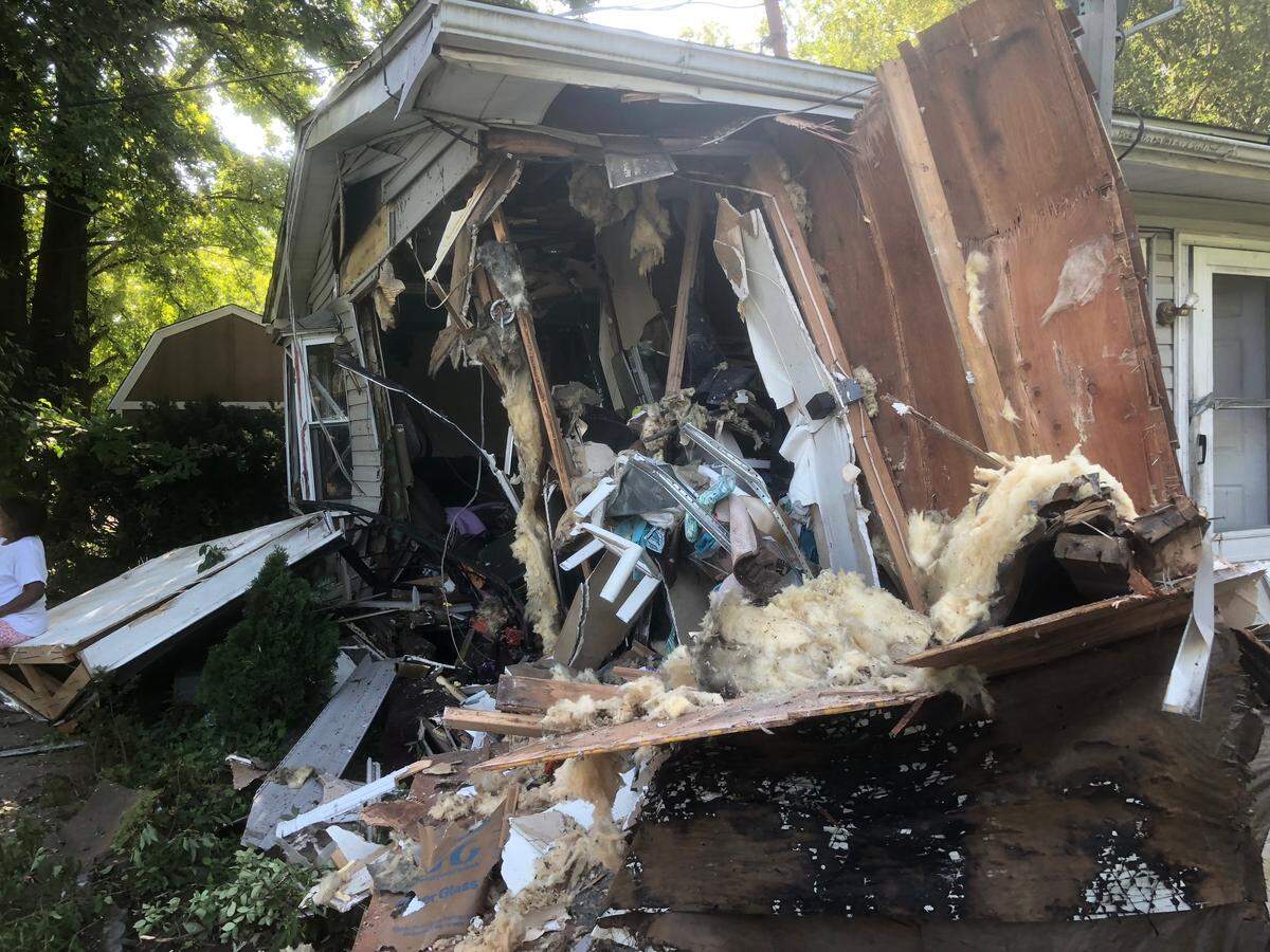 Police say a fleeing motorist hit an East St. Louis house Tuesday night after he lost control of his SUV and went airborne before crashing into the structure at 39th Street and Vanburen Avenue.