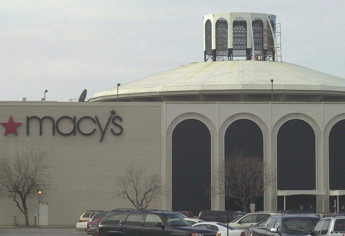 This 2006 file photo shows workers fixing tornado damage atop the Macy’s store at St. Clair Square in Fairview Heights. The building, which originally housed Famous-Barr, was built in 1973 by Ralph Korte Construction Co. 