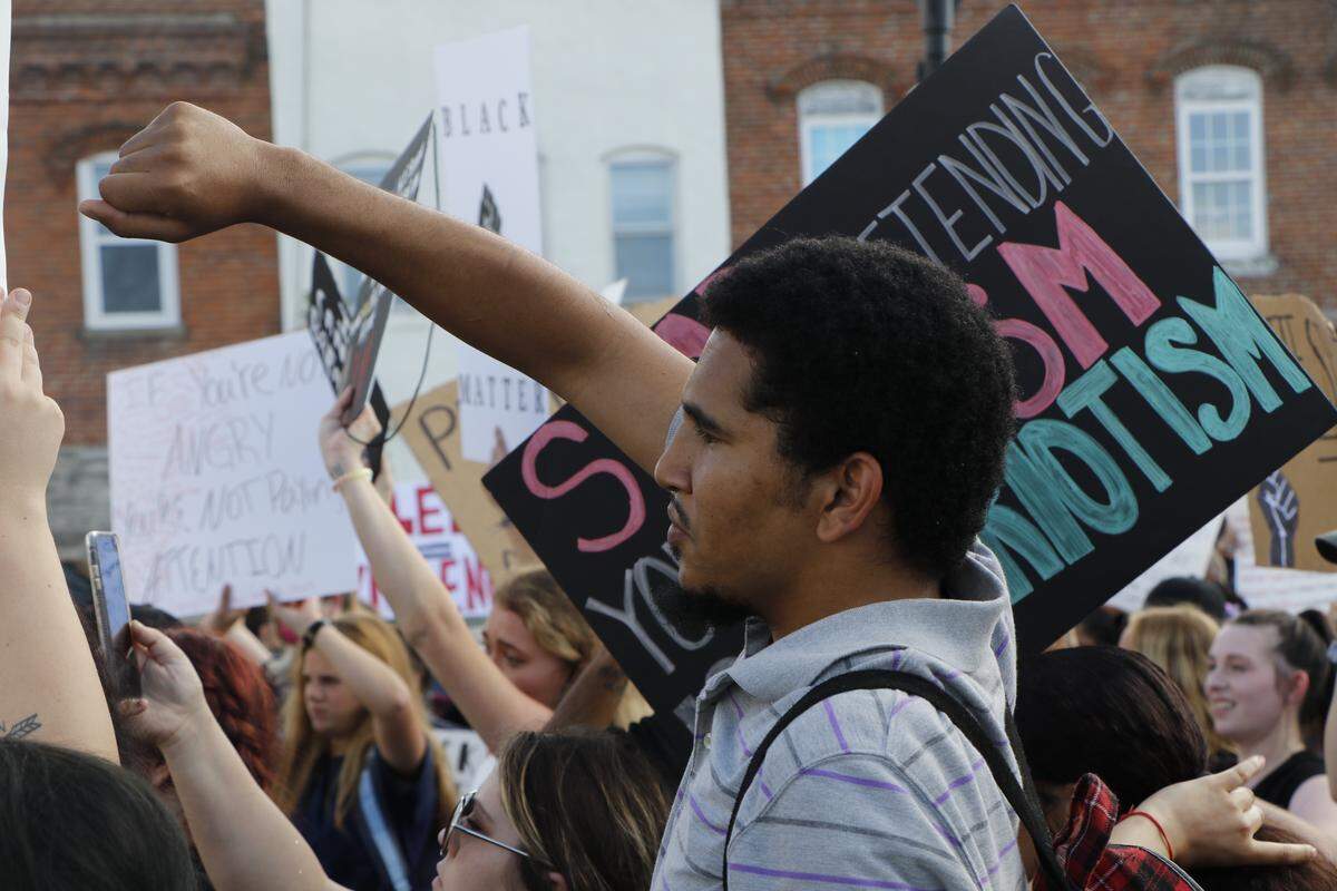 Aveon Winfield, 21, of Grand Chain, holds up his fist at a Black Lives Matter protest in Anna on June 4, 2020.
