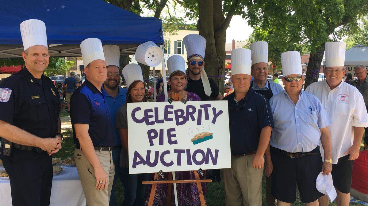From left are Highland celebrity pie bakers Terry Bell, Howard Held, Curt Libbra, Karen Simmons, Cindy Ludwig (standing in for John Ludwig), Will VerDuin, Mike Sutton, Jay Boulanger, Pete Korte and Joe Michaelis.