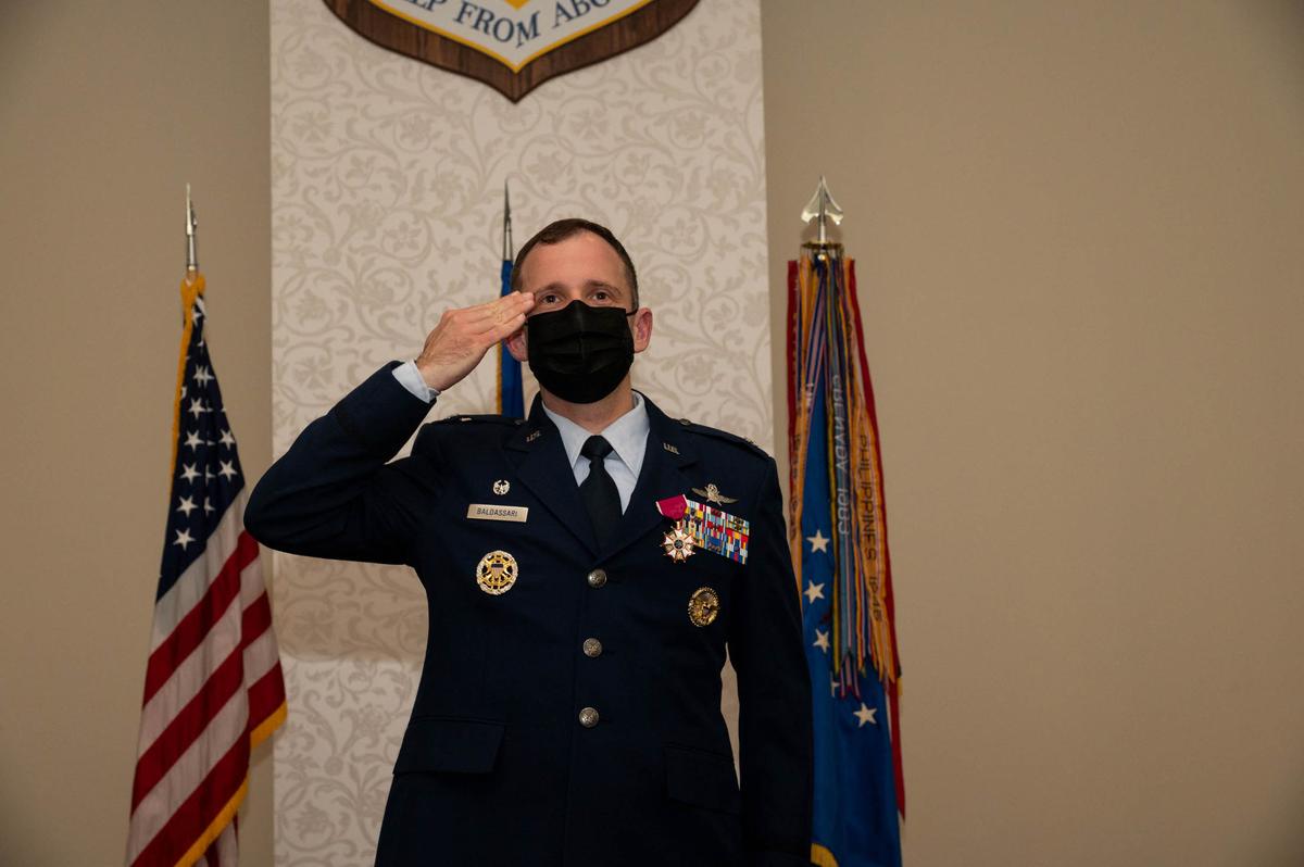 U.S. Air Force Col. Kyle Baldassari, 375th Communications Group commander, renders his final salute to members of the 375th CG during the 375th CG inactivation ceremony on Scott Air Force Base. The 375th CG was activated in 2007 and had the responsibility of supporting the mission of the 375th AMW in its global reach mission by providing command, control, communications and computer support to DoD, USTRANSCOM, AMC, 18th Air Force, SDDC, AFNIC, three flying wings, 31 tenant units and direct support to the 618th Air and Space Operations Center global mission.