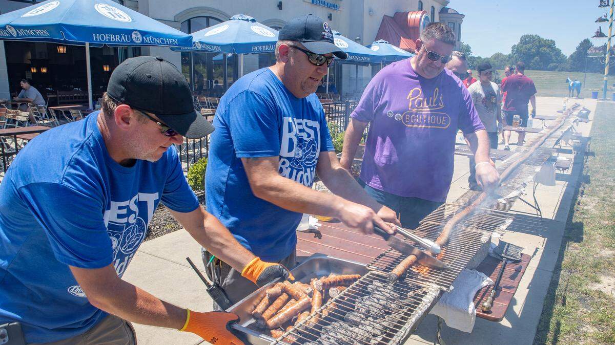 Andrew Jeffery, the executive chef for Hofbräuhaus St. Louis - Belleville, slices a 100 foot German Style bratwurst to serve to guests attending their 1st “Wurst Fest” on Saturday, June 18. The bratwurst was made by Schubert’s in Millstadt and grilled over hot charcoal by volunteers on a long grill. Chef Jeffery is hoping to grill up a 150 foot or longer bratwurst during their Oktoberfest celebration this fall. Hofbräuhaus St. Louis - Belleville is located at 123 St. Eugene Dr in Belleville, directly across from the Shrine of Our Lady of the Snows
