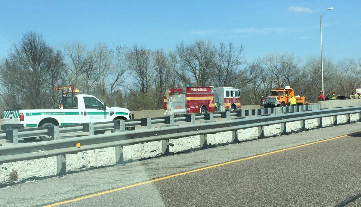 Emergency crews arrive at the scene of a fatal crash on Interstate 64 near mile marker 4 in East St. Louis Tuesday afternoon.