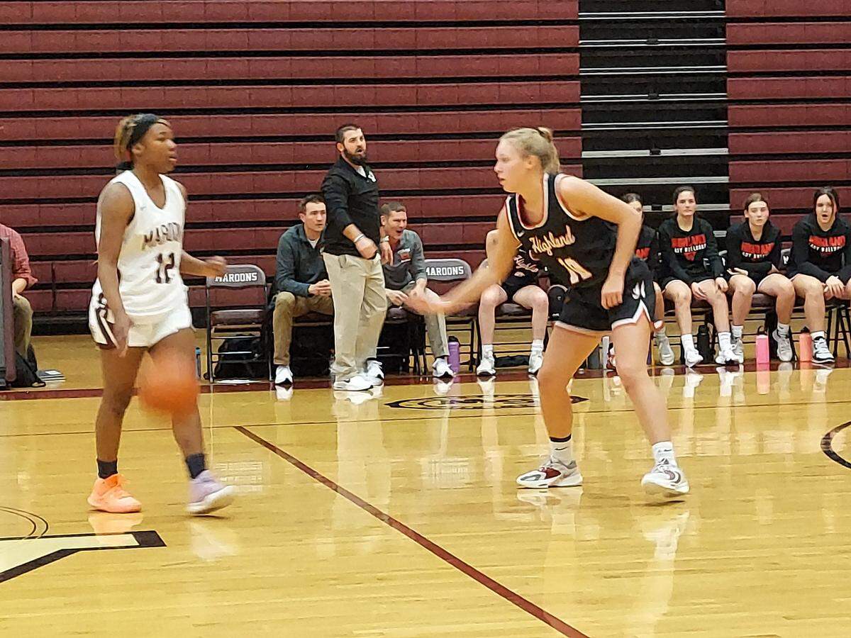 Bellevillle West guard M’Riya Johnson sets up a play against Highland guard Addison Crask during a non-conference game Monday, Dec. 5, at Belleville West High School. The Lady Bulldogs ultimately posted a 57-44 victory.