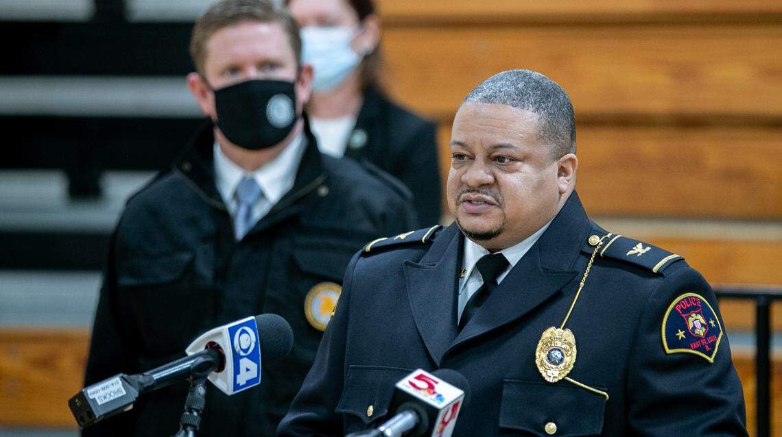 East St. Louis Police Chief Kendall Perry speaks as Illinois State Police Director Brendan Kelly listens in the background during the press conference in which they announced the formation of the Public Safety Enforcement Group in December 2020.