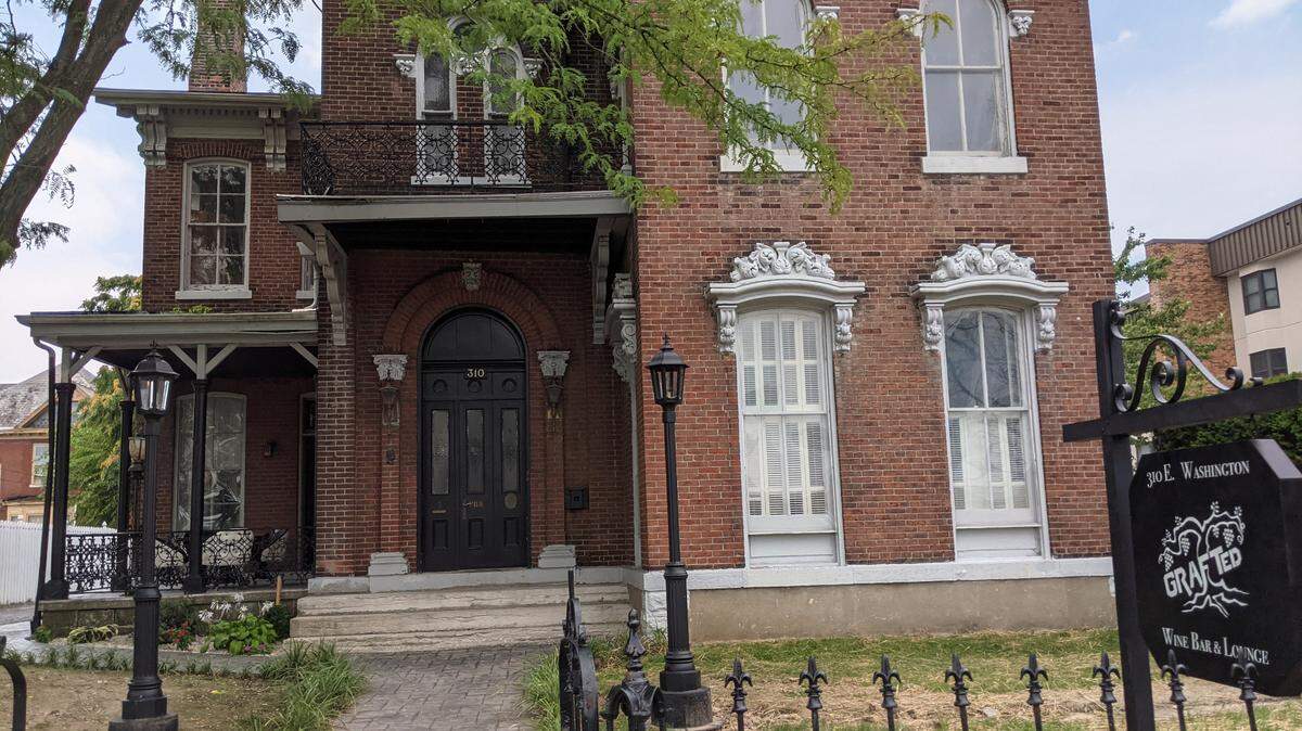 The sidewalk at Grafted Wine Bar & Lounge is flanked by recently installed gaslights.