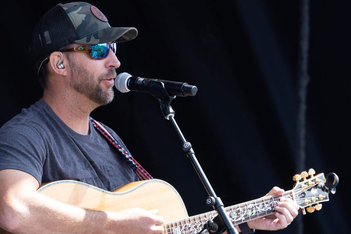 Former St. Louis Cardinal ace turned country music artist Adam Wainwright performs a song about going home during the Enjoy Illinois 300 Cup Race at WorldWide Technology Raceway in Madison on June 2, 2024. “I love being home,” Wainwright said, “especially up on that mound.”