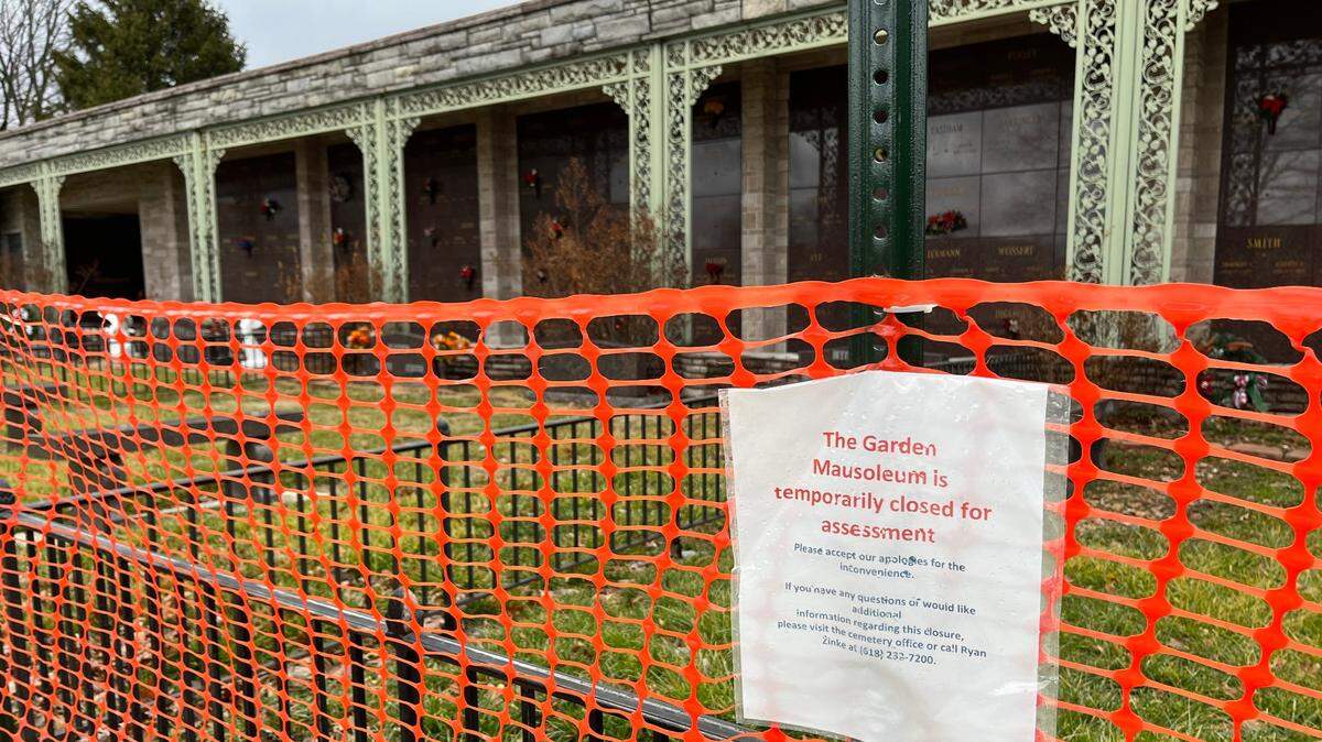 Flyers on orange plastic fencing around a mausoleum at Lake View Memorial Gardens in Fairview Heights tells visitors that the area is temporarily closed for “assessment.”