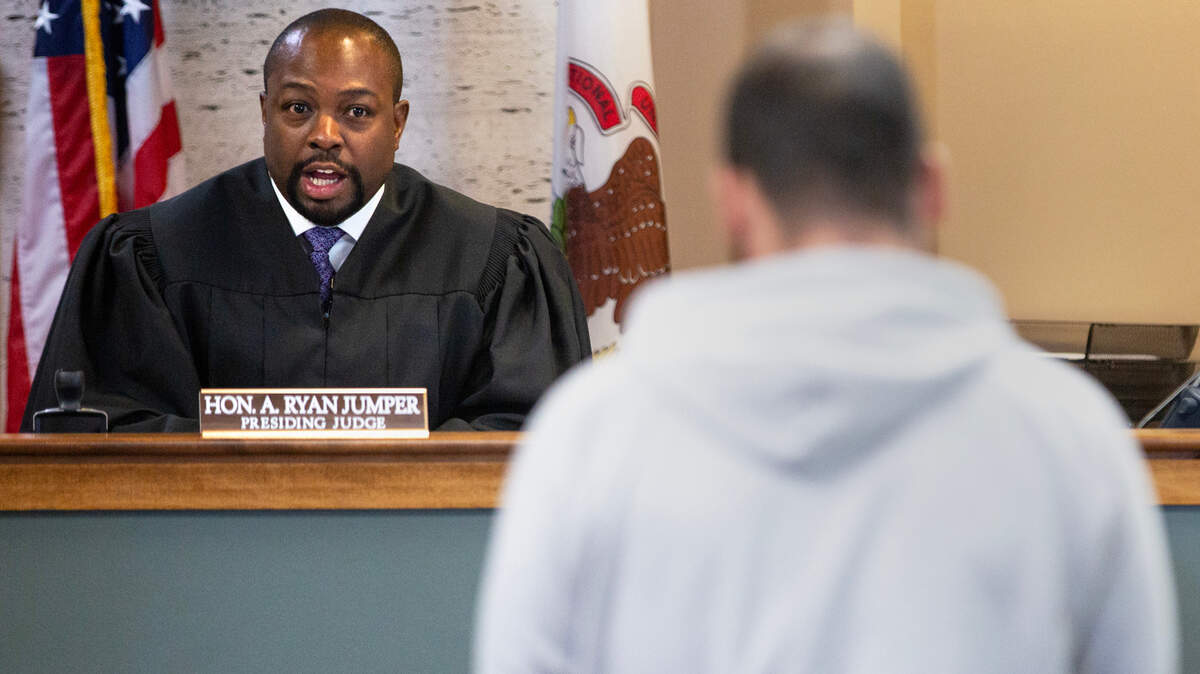 Associate Judge Ryan Jumper, left, speaks to a defendant on the first day of Illinois having no cash bail, on Monday, Sept. 18, 2023, at the Madison County Courthouse. 