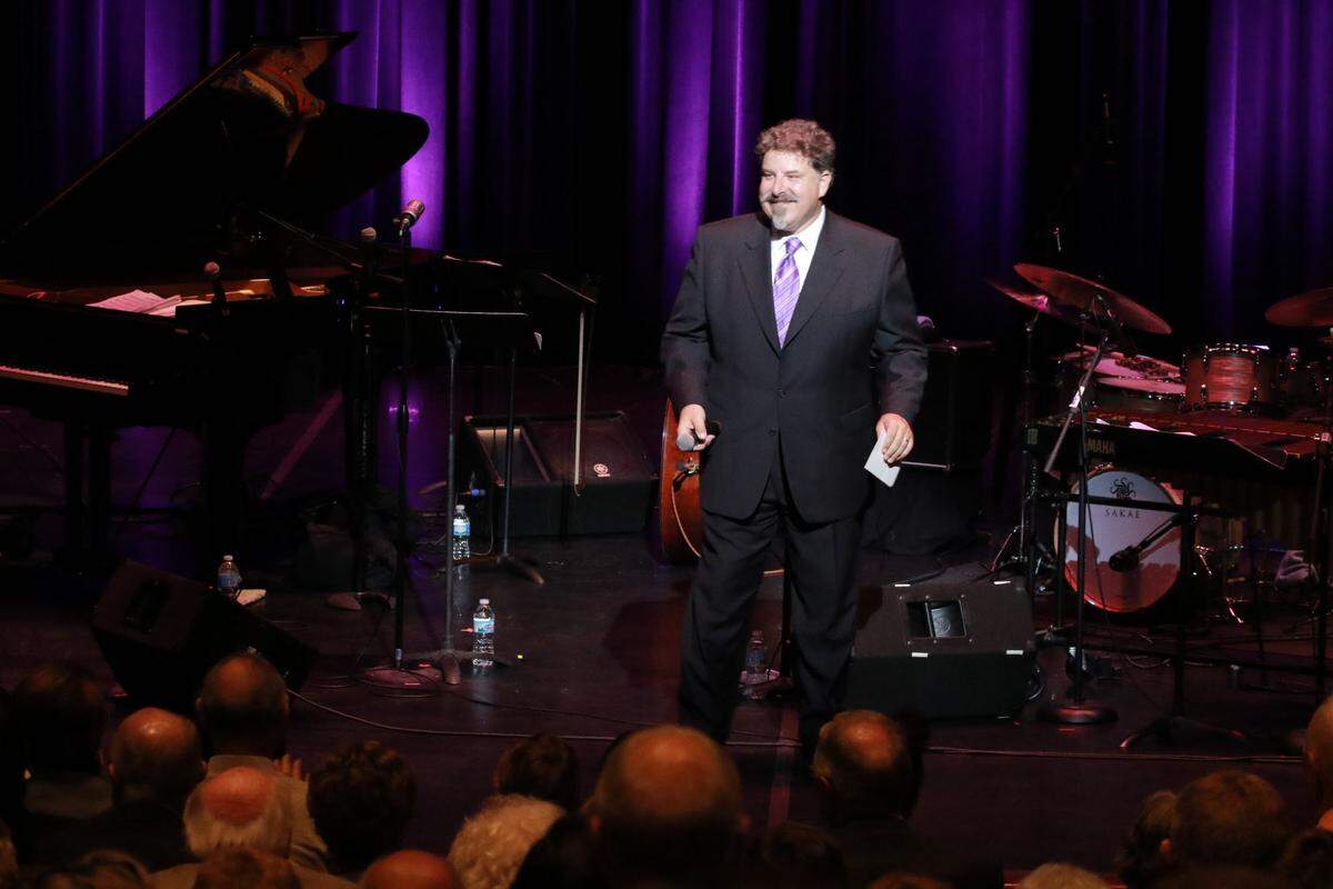 Peter Palermo, founding director of The Russel E. and Fern M. Hettenhausen Center for the Arts at McKendree College in Lebanon, introduces a band at its 10th anniversary gala in 2016.