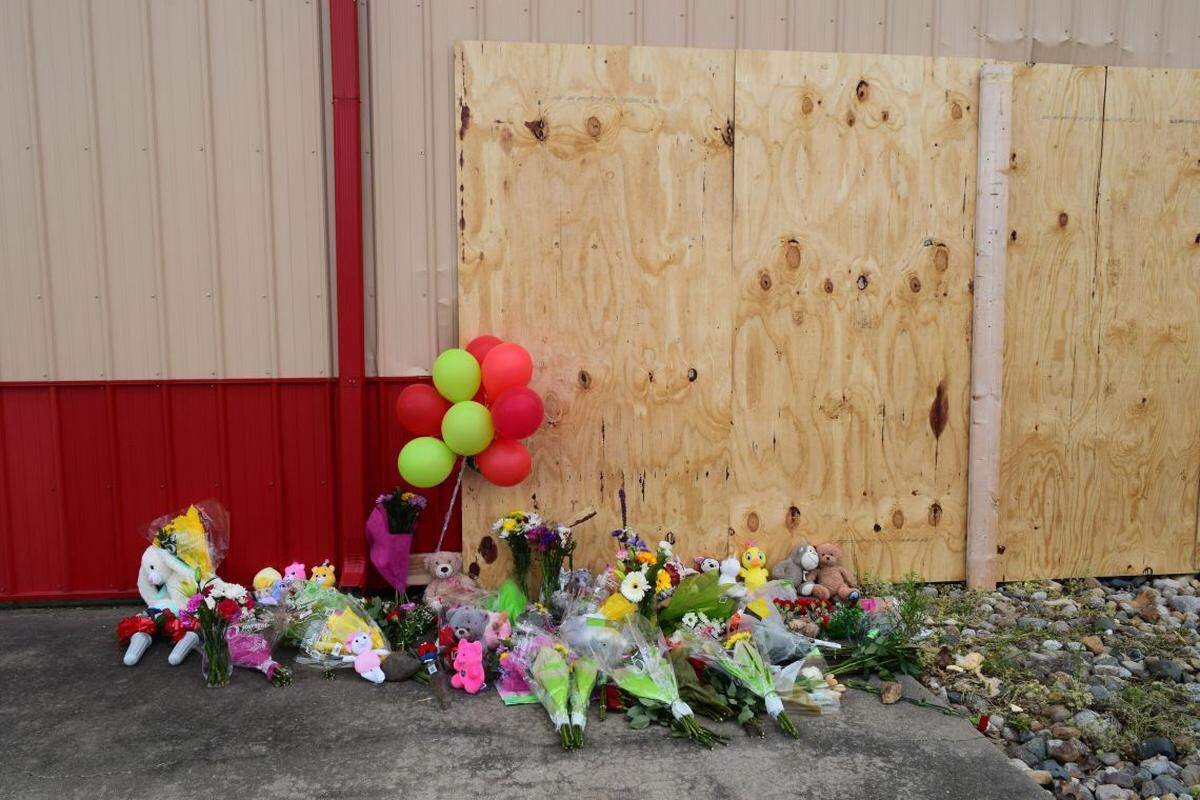 A memorial sprang up for three children and a teen who died when a Jeep crashed through a building that housed an after-school program in Chatham. (Capitol News Illinois photo by Jade Aubrey)