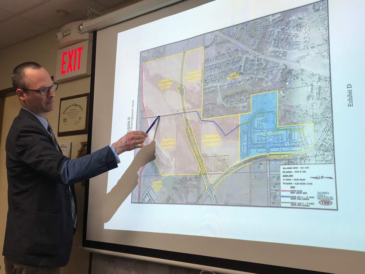 Ernesto R. Segura, real estate development attorney from Husch Blackwell in St. Louis, Mo. representing The Savannah multi-family housing developer, presents information about the proposed sanitary sewer agreement to the village Board of trustees Monday, Feb. 26 during its monthly committee at large meeting.
