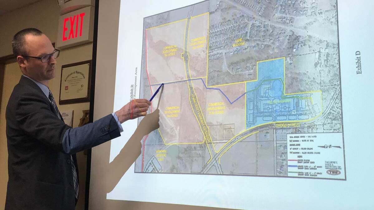Ernesto R. Segura, real estate development attorney from Husch Blackwell in St. Louis, Mo. representing The Savannah multi-family housing developer, presents information about the proposed sanitary sewer agreement to the village Board of trustees Monday, Feb. 26 during its monthly committee at large meeting.