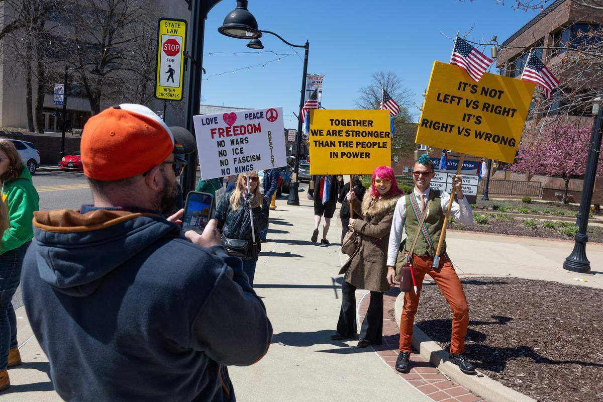 No Kings protesters on Belleville Public Square on Saturday line up for a photo. The protest was one of more than a dozen held in the St. Louis area as part of a national movement.