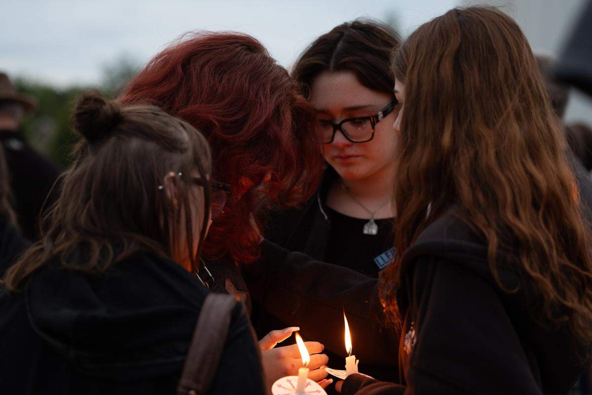 Classmates and friends of Cadence E. Prince gather together at a candlelight vigil in her memory on Memorial Day.