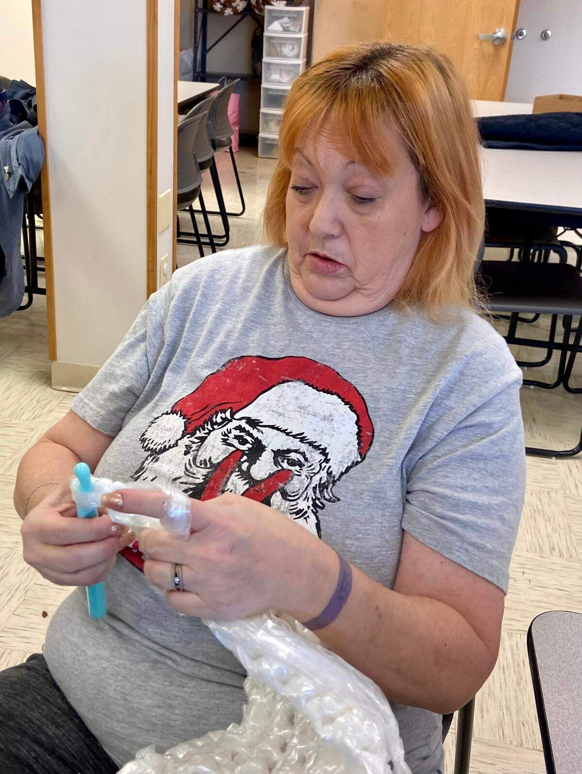 Julie Merinda of Troy crochets the “plarn” into a mat for homeless people to use. Volunteers such as Merinda gather Thursday mornings at St. Michael’s Episcopal Church in O’Fallon to prepare mats that are given to people who are houseless.