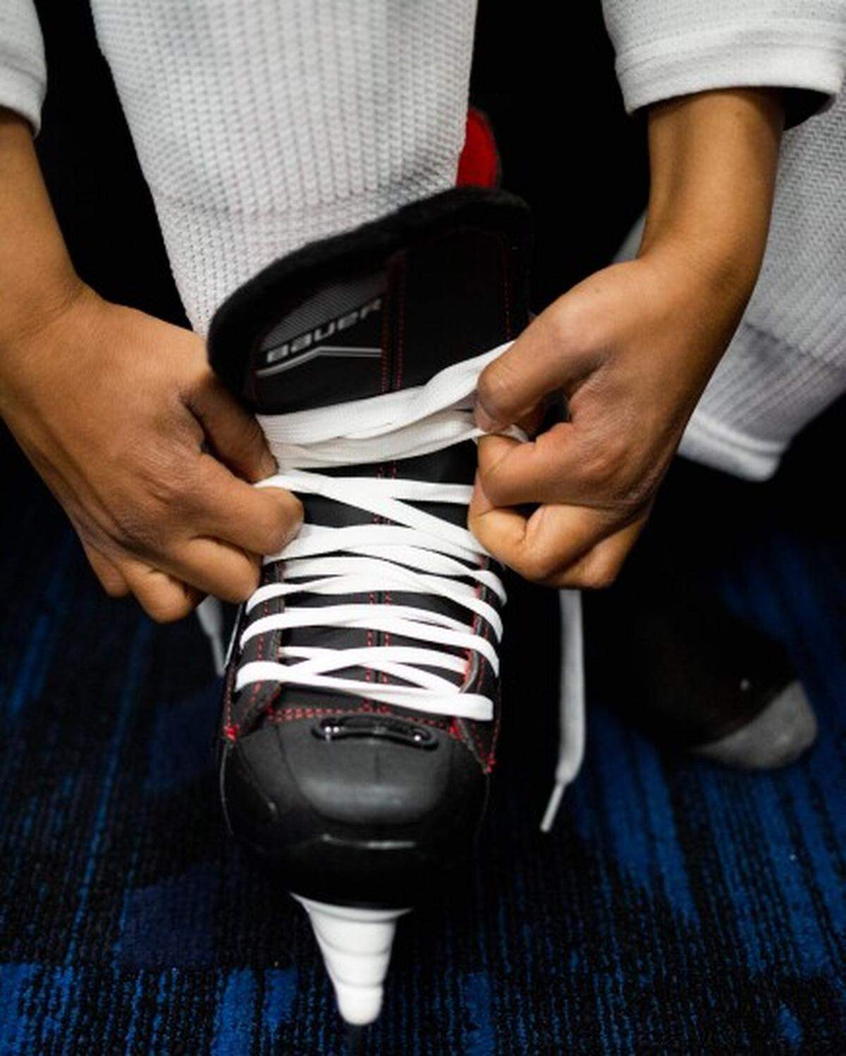 Matthias Thompson, 12, of north St. Louis, puts on skates March 9 at the Enterprise Center in St. Louis. The North City Blues is the St. Louis Blues’ newest youth hockey initiative launched to offer a free after-school program to students ages 4-10 enrolled in KIPP Schools and/or Friendly Temple Christian Academy.
