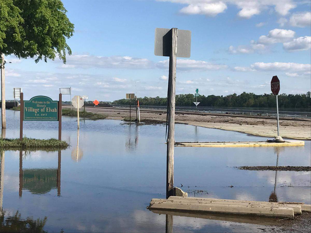 The Great River Road, part of Illinois 100, flooded on Monday near Elsah.