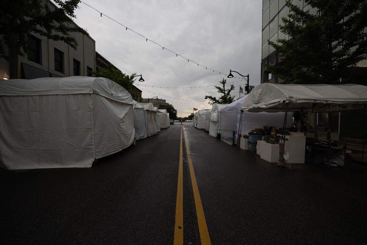 Tents remained closed while a thunderstorm rolled through Belleville on Friday, disrupting Art on the Square before it even began.
