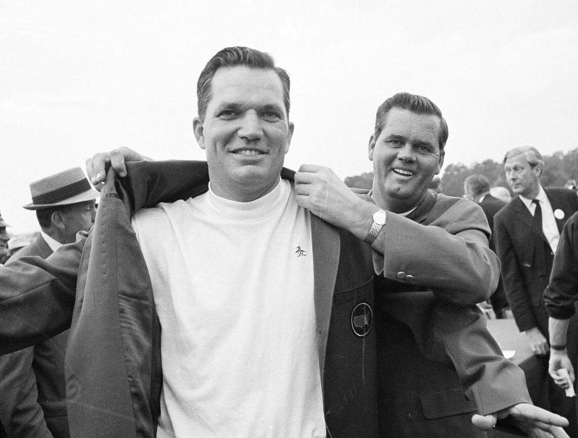 Bob Goalby, left, gets the traditional green coat as champion of the of the Masters Golf tournament at Augusta, Ga., April 14, 1968,  from Gay Brewer.