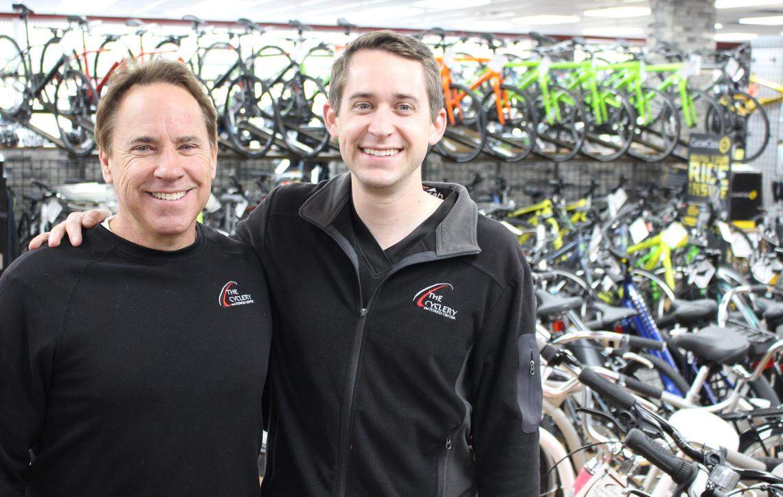 Steve Parks, left, owner of The Cyclery stores, is shown in 2019 with son David, who is gradually taking over the business and now manages the Edwardsville location.