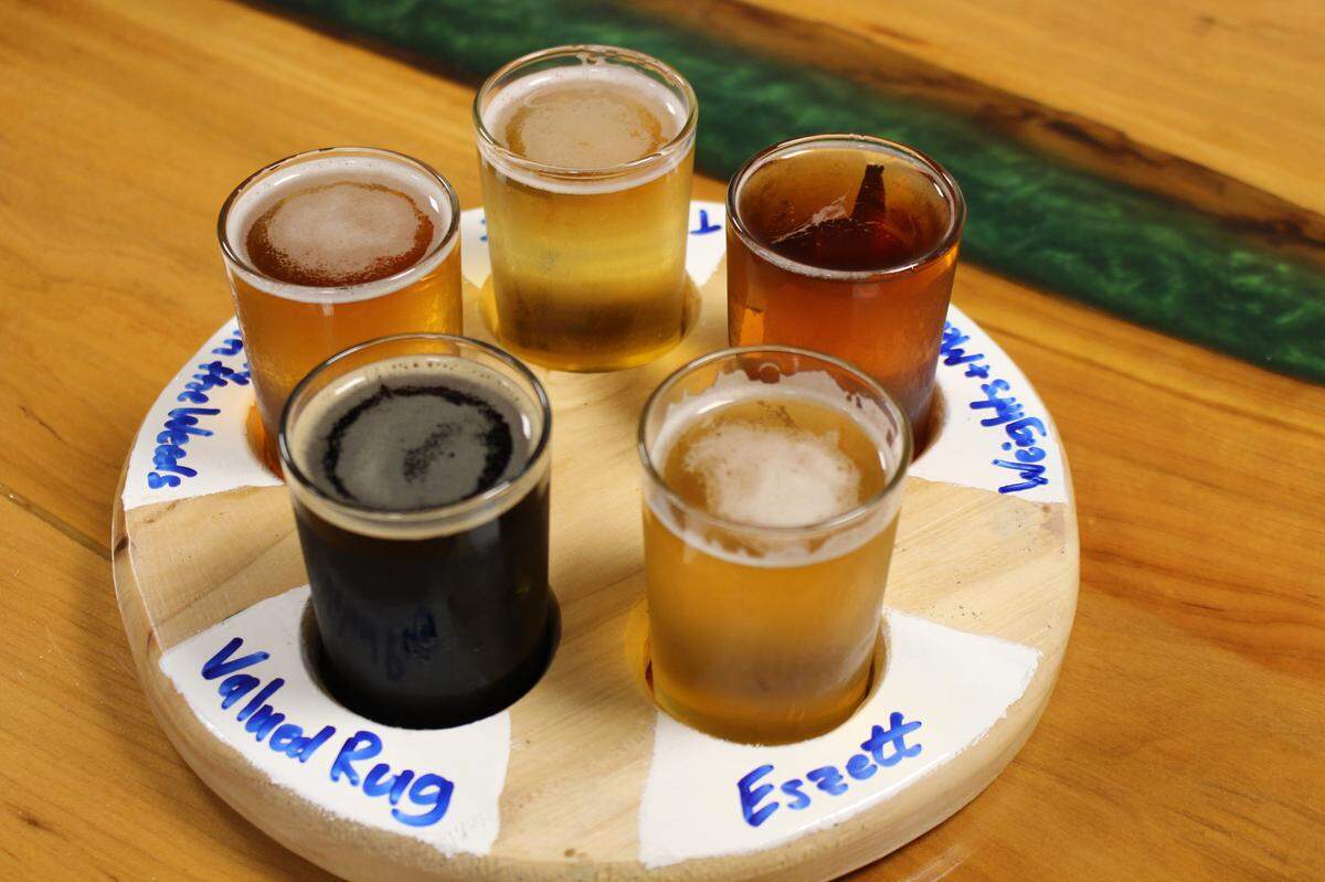Customers can get five, 5-ounce samples of housebrewed beer for $10 at Millpond Brewing & Incubator in Millstadt. Larger glasses range from $5.50 to $6.