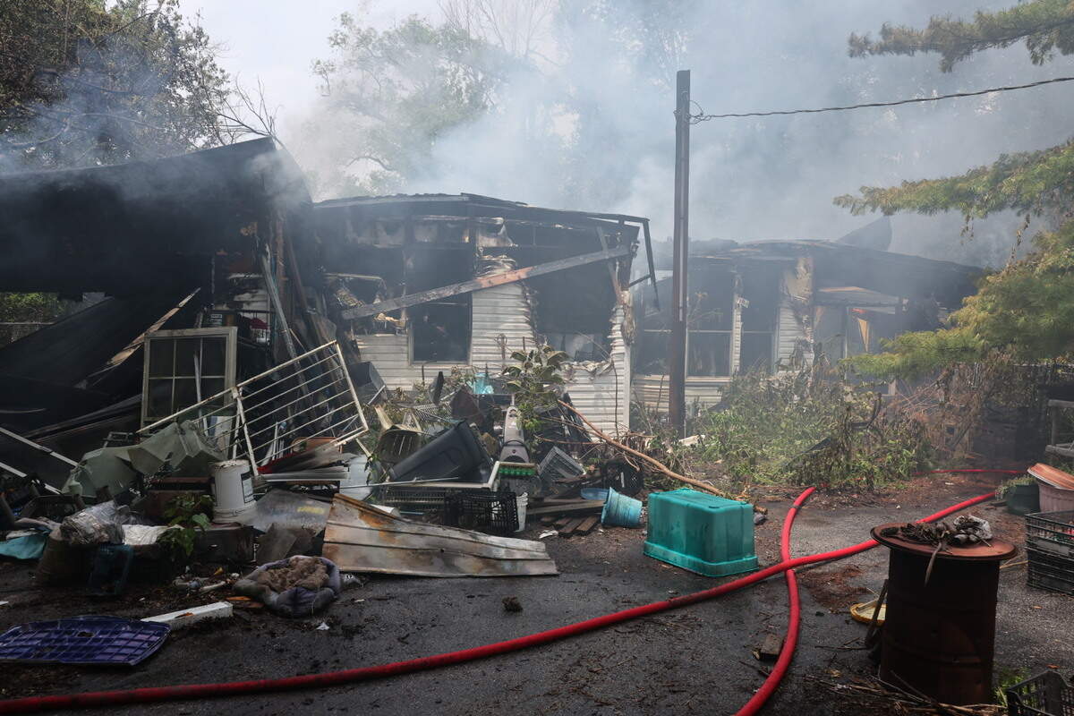 A Wednesday morning fire that destroyed a Collinsville home continues to burn in the early afternoon.