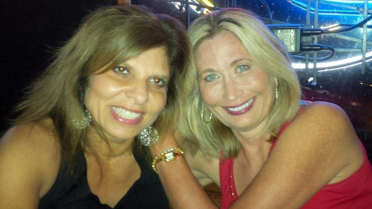 Michelle Meehan Schrader, right, poses for a photo with her best friend Lydia Kachigian.