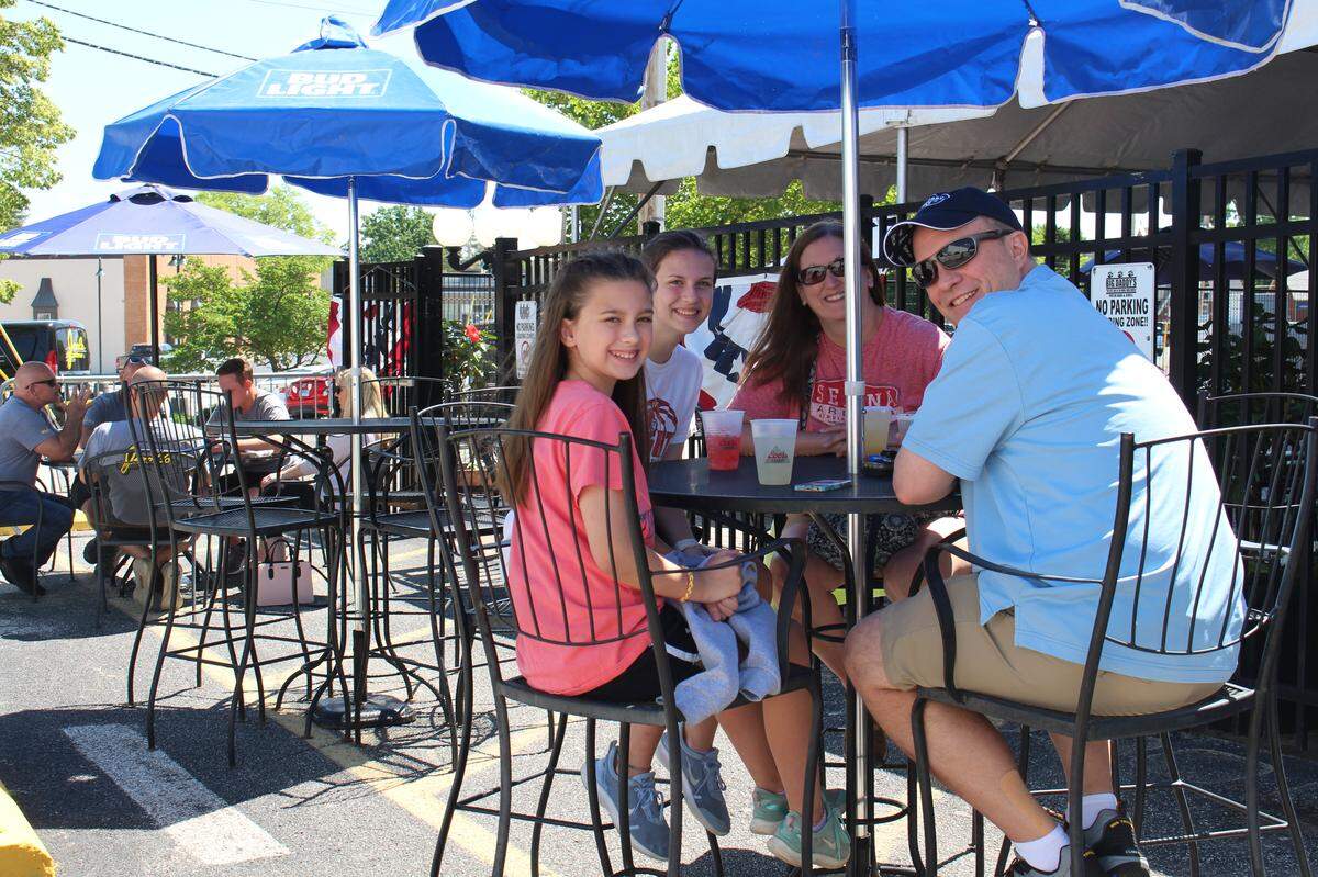 Bill Kobler, clockwise from right, daughters Callie and Addie and wife Emily celebrate Callie’s 11th birthday with lunch at Big Daddy’s Edwardsville on Friday.
