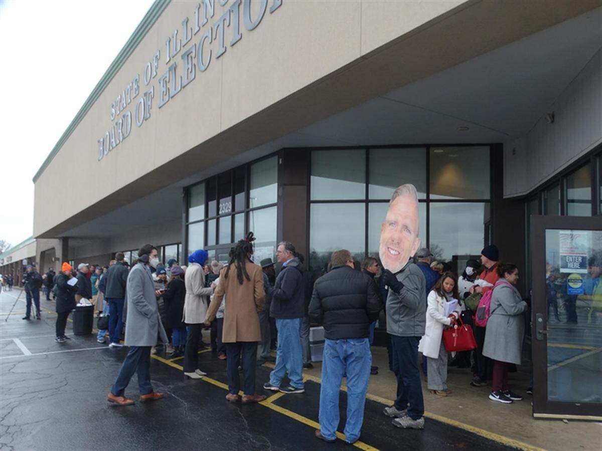 Candidates and their staffs line up outside the Illinois State Board of Elections office early Monday morning, the first day major party candidates could submit petitions to get their names on the June 28 primary election ballot.