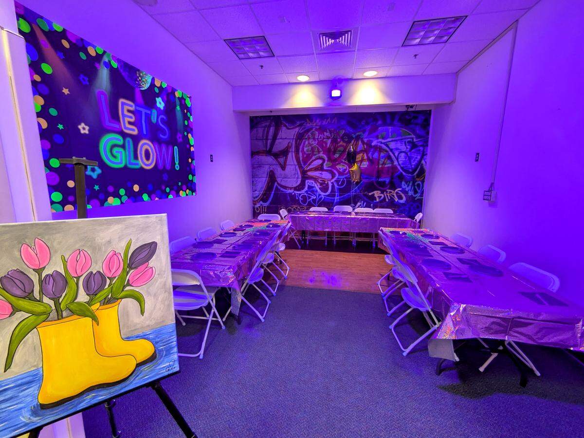 View of the back room with the black lights at Let's Paint