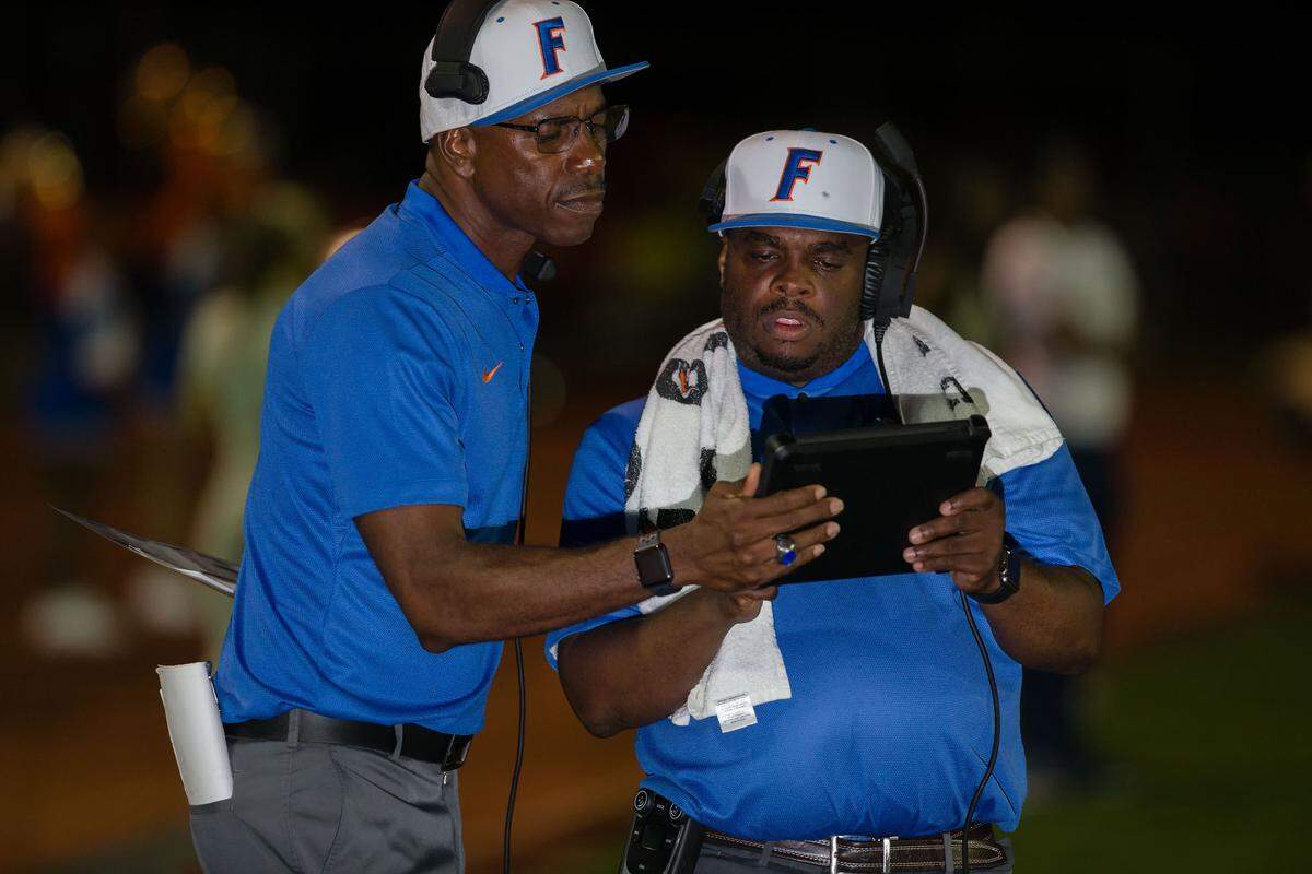  East St. Louis head coach Darren Sunkett & coach Hadith Mitchum as seen during Saturday’s game at Clyde Jordan Stadium.