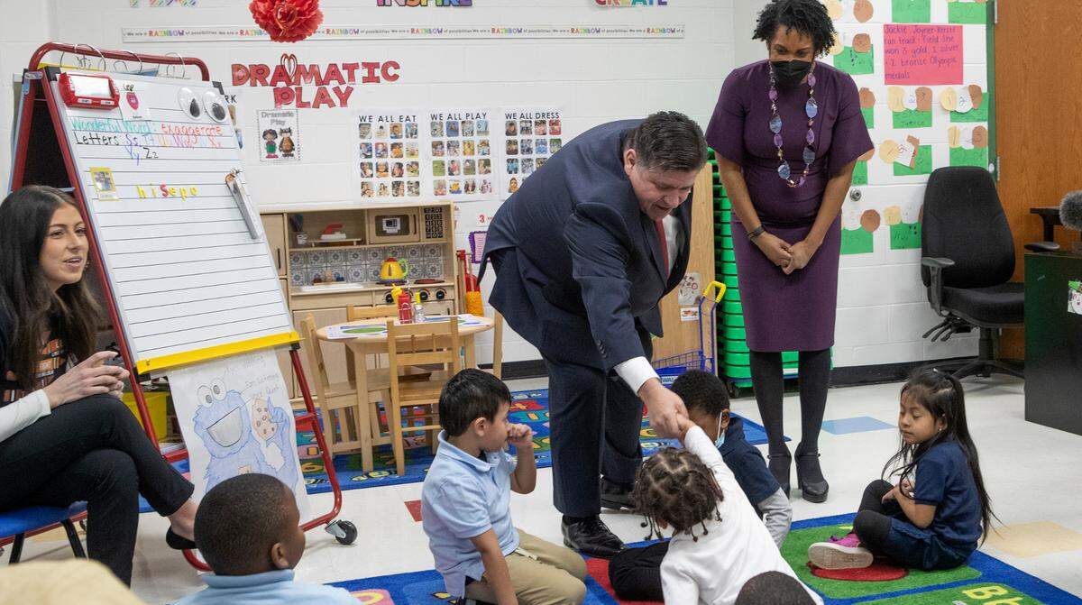 Illinois Gov. J.B. Pritzker and Lt. Gov. Juliana Stratton visit with students Thursday in a class at Vivian D. Adams Early Childhood Center in East St. Louis. Pritzker’s visit was to show his priority for universal pre-kindergarten and showcase a current free, full-day, state certified Gold Circle of Excellence preschool program.