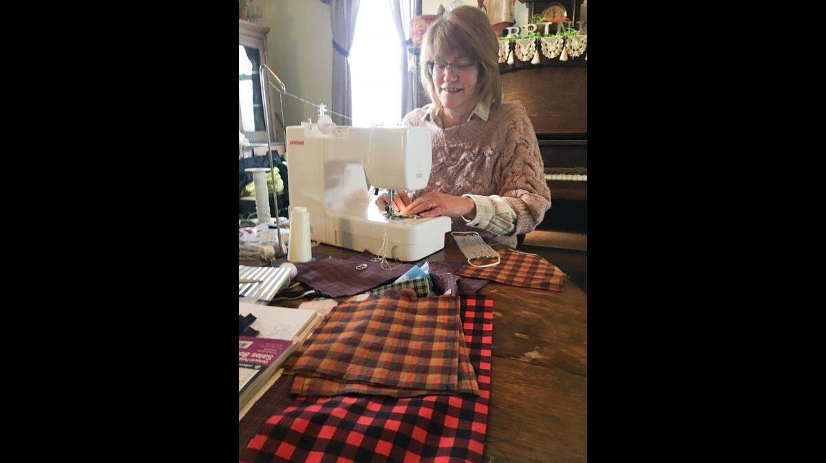 Rural Highland resident Tammy Brink is shown in late April, after sewing more than 1,300 cloth face coverings for people in Alton, Granite City, Edwardsville, St. Louis and surrounding communities.
