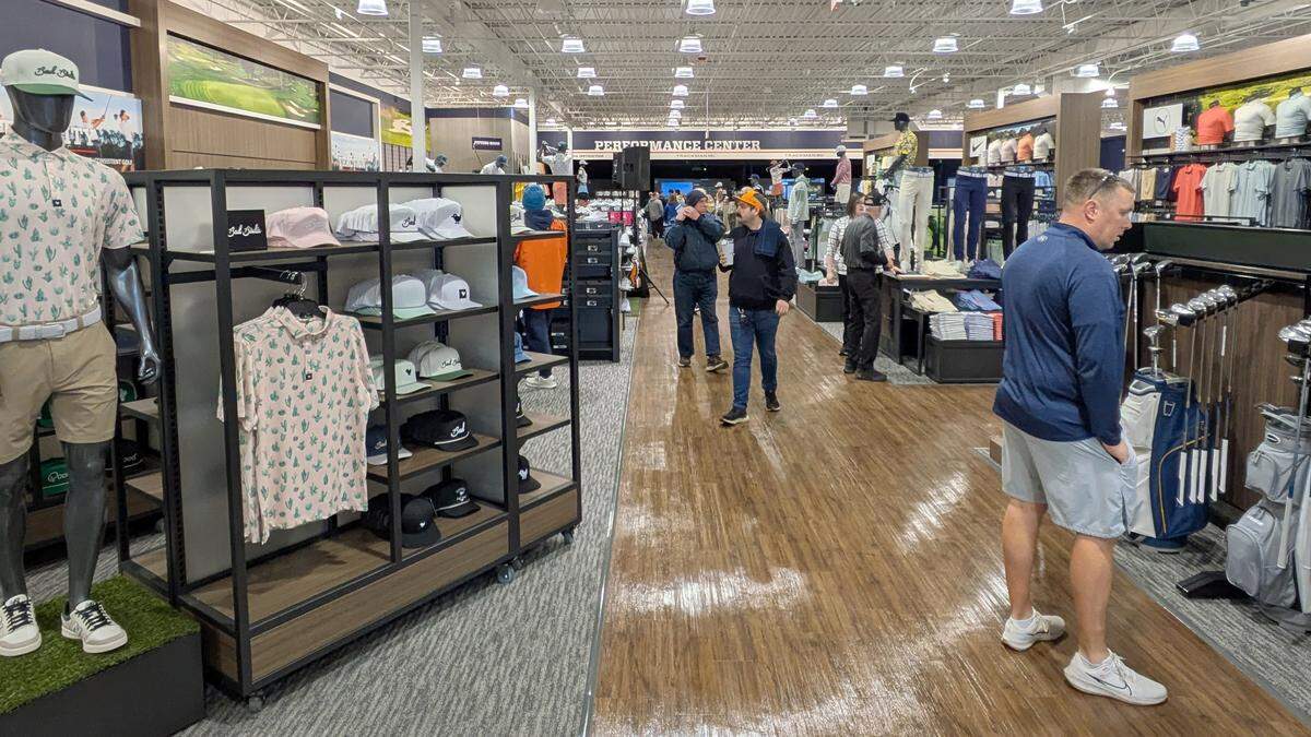 Customers take a look around the new Golf Galaxy store in Fairview Heights.