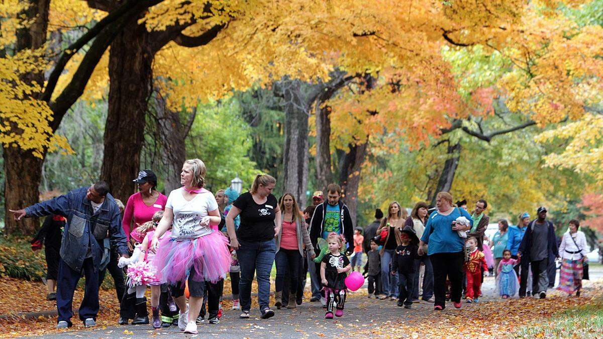 Costumed students, teachers and parents walk along Signal Hill Boulevard in 2019 for the Signal Hill School Halloween parade in Belleville.
