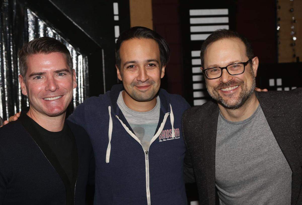 Hamilton creator Lin-Manuel Miranda, center, poses backstage with Prom lyricist Chad Beguelin, left, and composer Matthew Sklar. right.