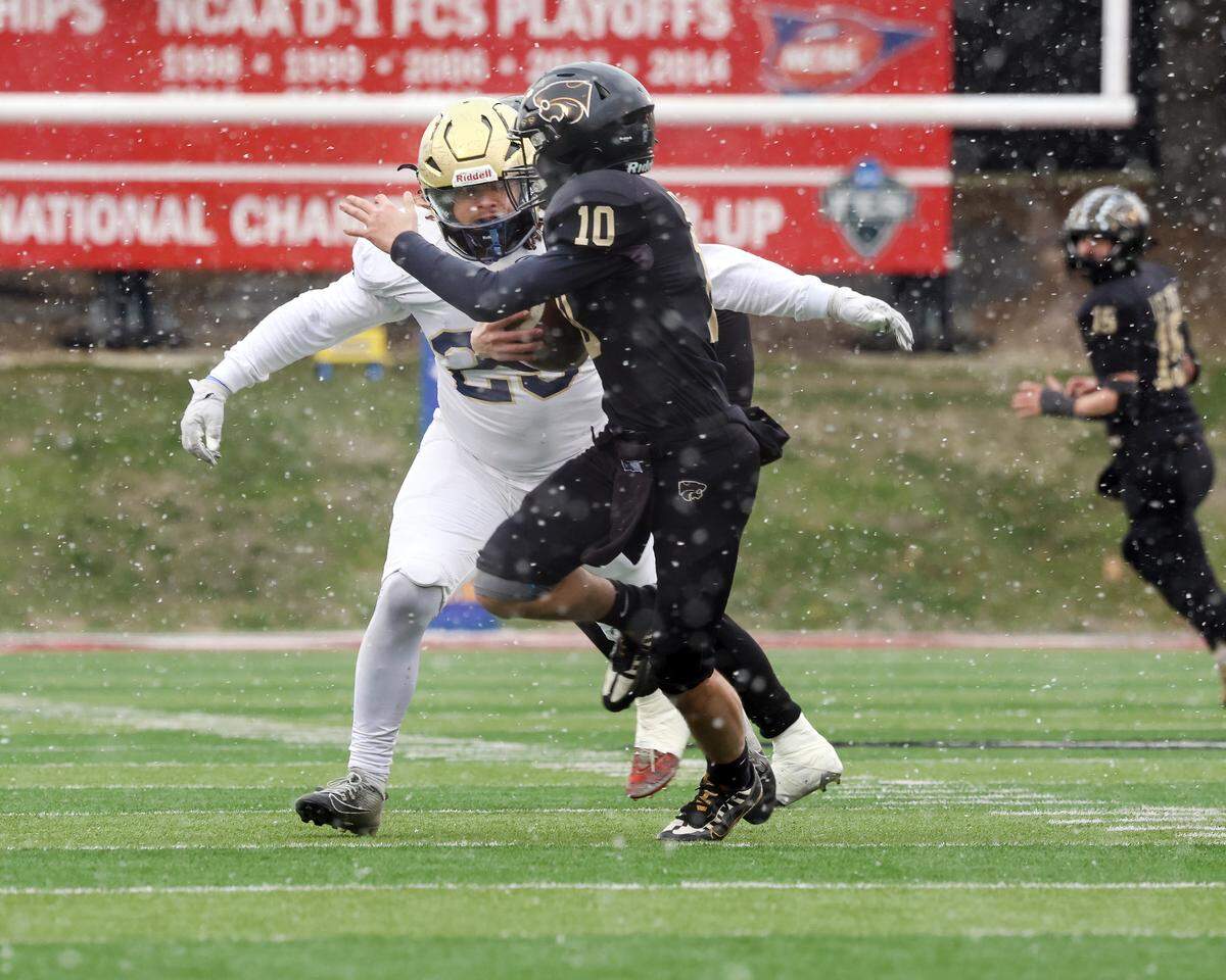 Althoff’s Asher Peterson sacks Lena-Winslow quarterback Kasch Lessman during the IHSA Class 1A championship game at Hancock Stadium on the campus of the Illinois State University.