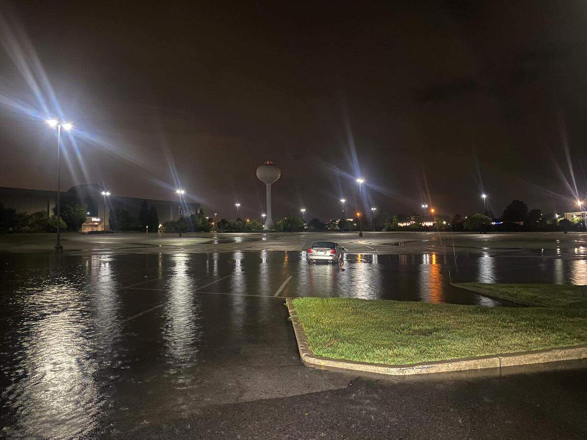 Heavy rains on Friday night caused flooding in the parking lot at St. Clair Square shopping mall, shown here, and at the intersection of Illinois 159 and U.S. 50 in Fairview Heights.