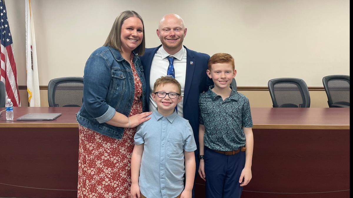 Joe Rujawitz with his family after he was voted to be Belleville East High School’s next principal at Monday evening’s school board meeting. From left to right are Beth, Joe, Kaden and Connor Rujawitz.