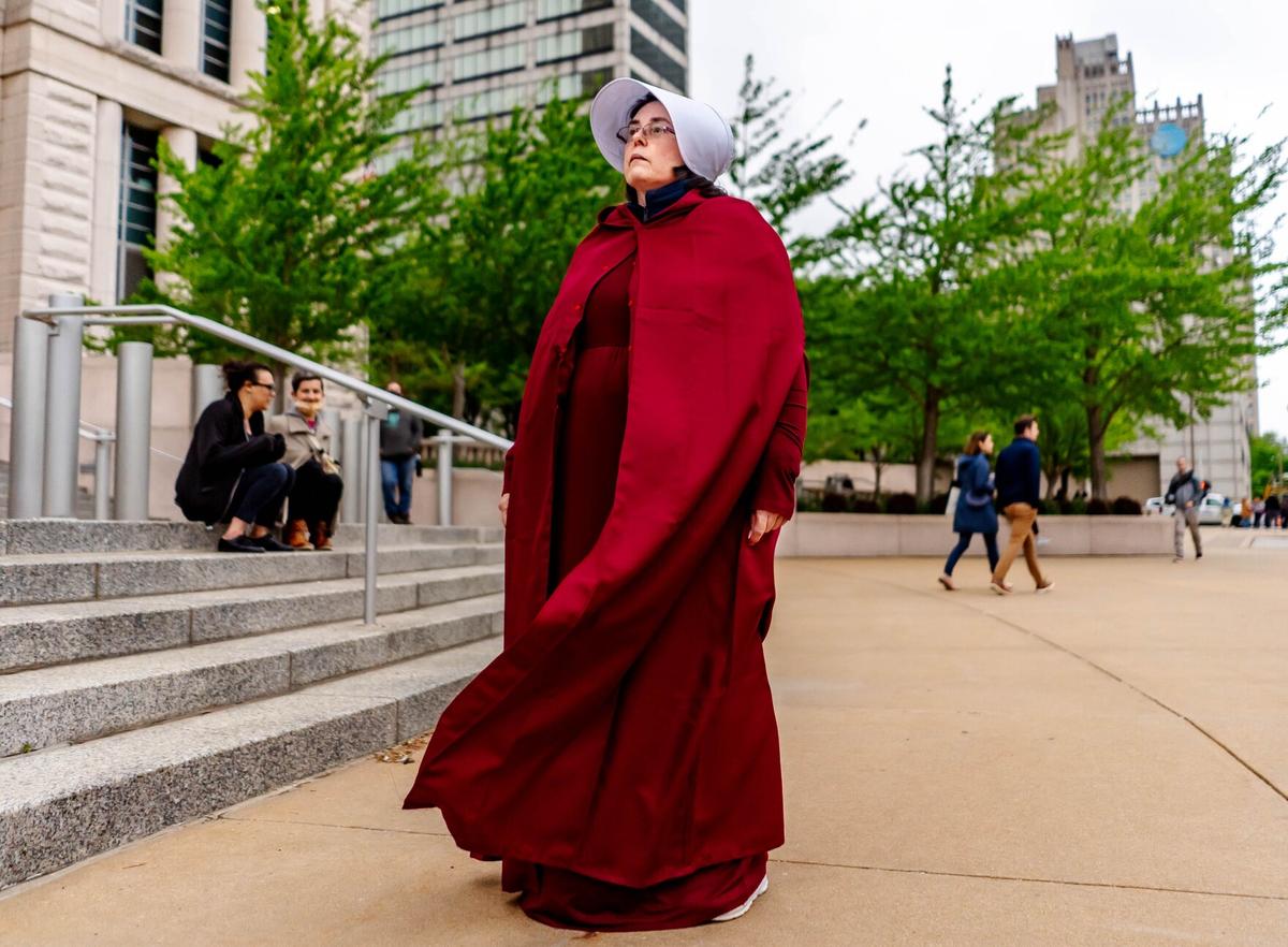 Ericka Murphy, of Eureka, Missouri, attends a demonstration rallying for abortion rights while dressed in a Handmaid’s Tale costume May 3 at the Thomas F. Eagleton U.S. Courthouse in downtown St. Louis. The demonstration comes a day after a draft of a Supreme Court opinion largely overturning the precedent set by Roe v. Wade was leaked and subsequently published by Politico. “When I heard about the leaked draft decision, I knew I had to come out in person to let the Supreme Court know that I am angry,” she said. “I am angry they’re going to do this.”