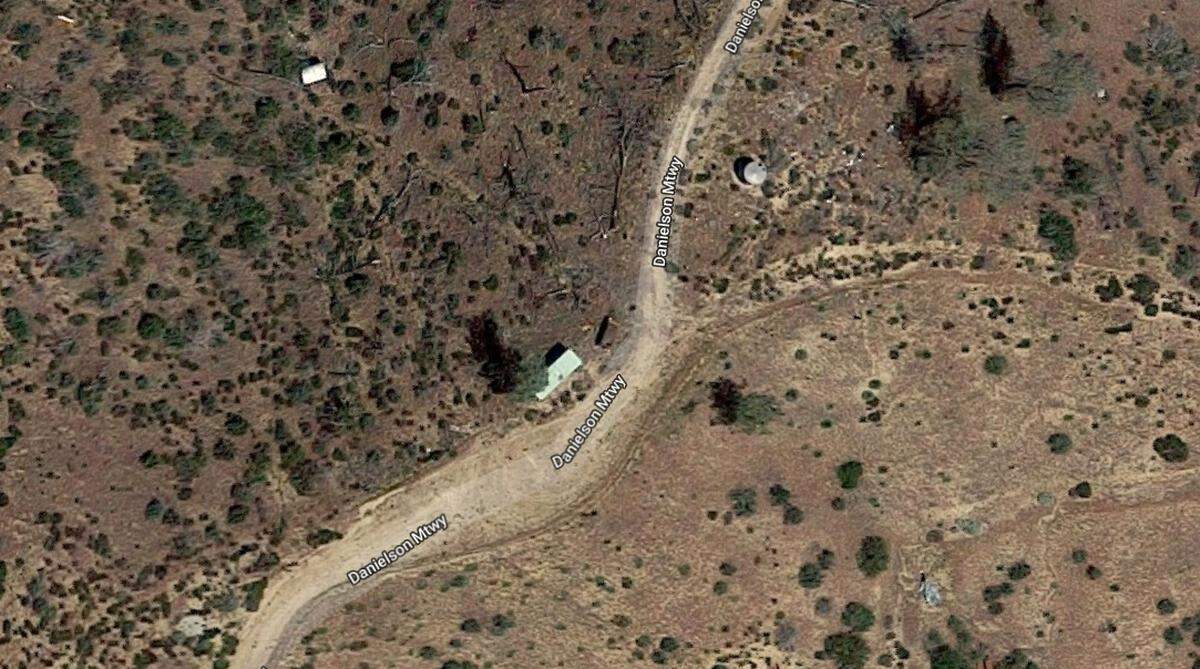 This Google Maps aerial photo shows the Wild Cherry van (brown rectangle next to the white rectangle) along a mountain road that crosses California property owned by Laura and Steven Godin.