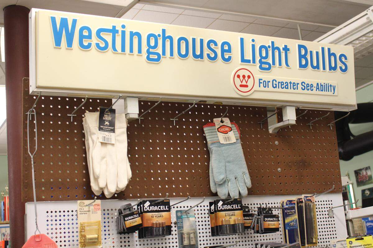 A vintage sign for Westinghouse light bulbs tops a small hardware section at Hellige’s Super Market & Lockers in Breese.