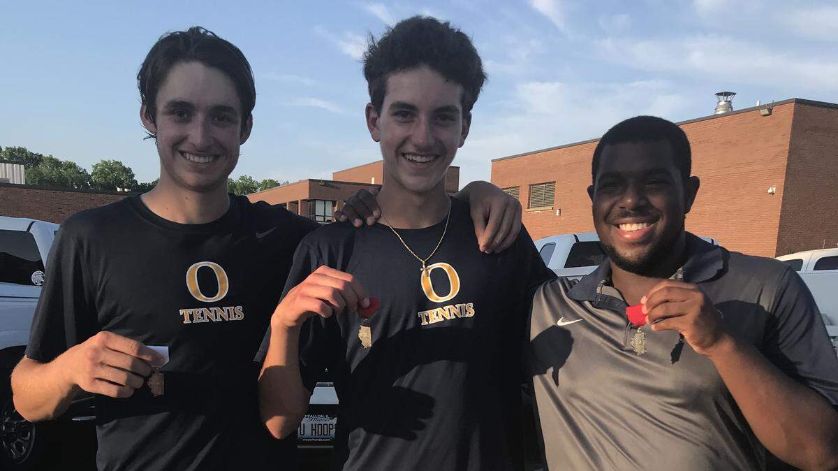 From left, OTHS tennis players Dominic Macaluso, Niko Papachrisanthou and Quincy Dollison show off the medals they won at the Belleville East Sectional.