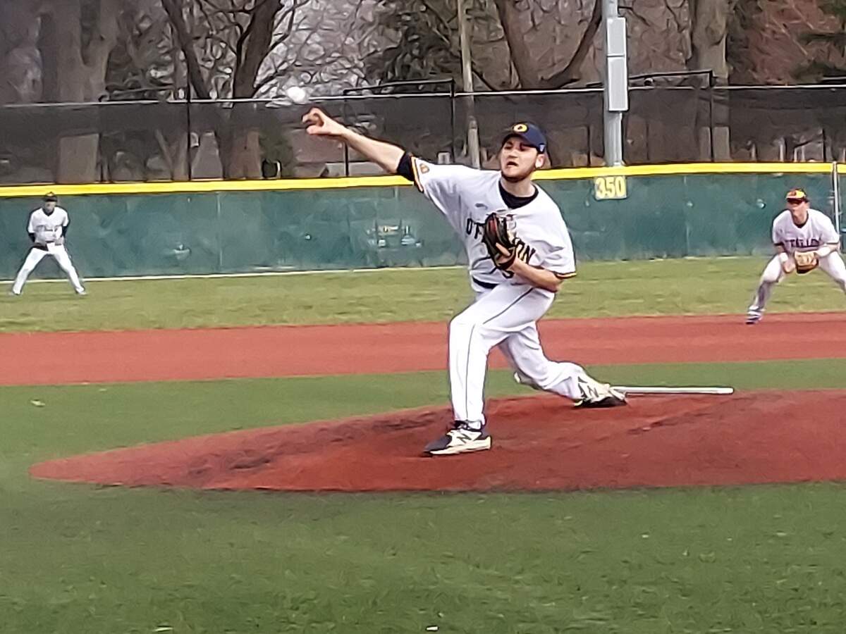 O’Fallon starter Mike Larson fires a pitch toward home plate during a non-conference game against Highland on Tuesday, March 29, at Blazier Field in O’Fallon. The Panthers ultimately edged the Bulldogs 4-3 in eight innings.