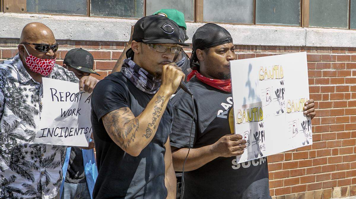 J.D. Dixon, center, speaks at a Black Lives Matter protest on June 19 at Empire Comfort Systems in Belleville, where he works. He plans to lead another rally on Friday.