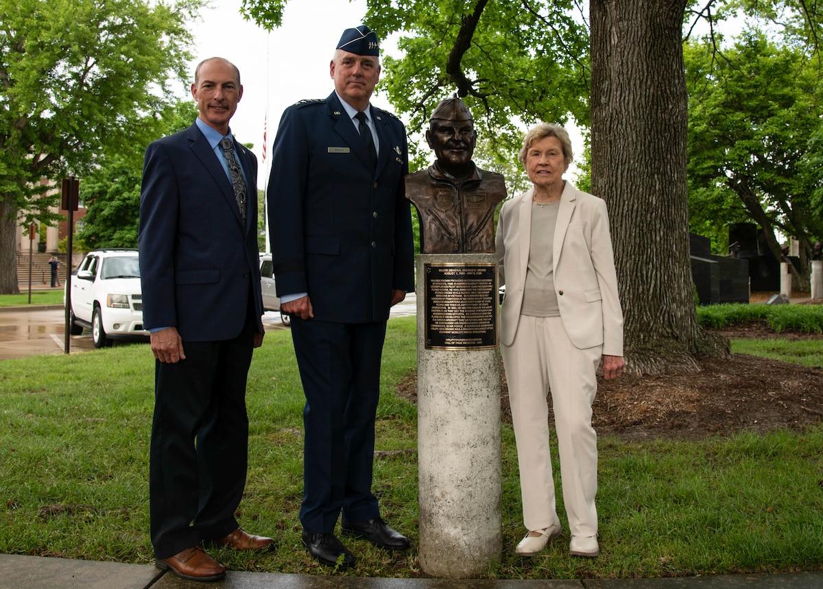 Larry Williams Jr., Airlift/Tanker Association president; Gen. Mike Minhan, Air Mobility Command commander; and Joan Brown, spouse of the late Maj. Gen. Donald D. Brown stand next to the newly unveiled bust of Gen. Brown on Scott Air Force Base. For his significant contributions to aviation, Gen. Brown was inducted into the A/TA Hall of Fame in 2021 and his likeness will remain located at the A/TA’s Memorial Walkway located near AMC headquarters.