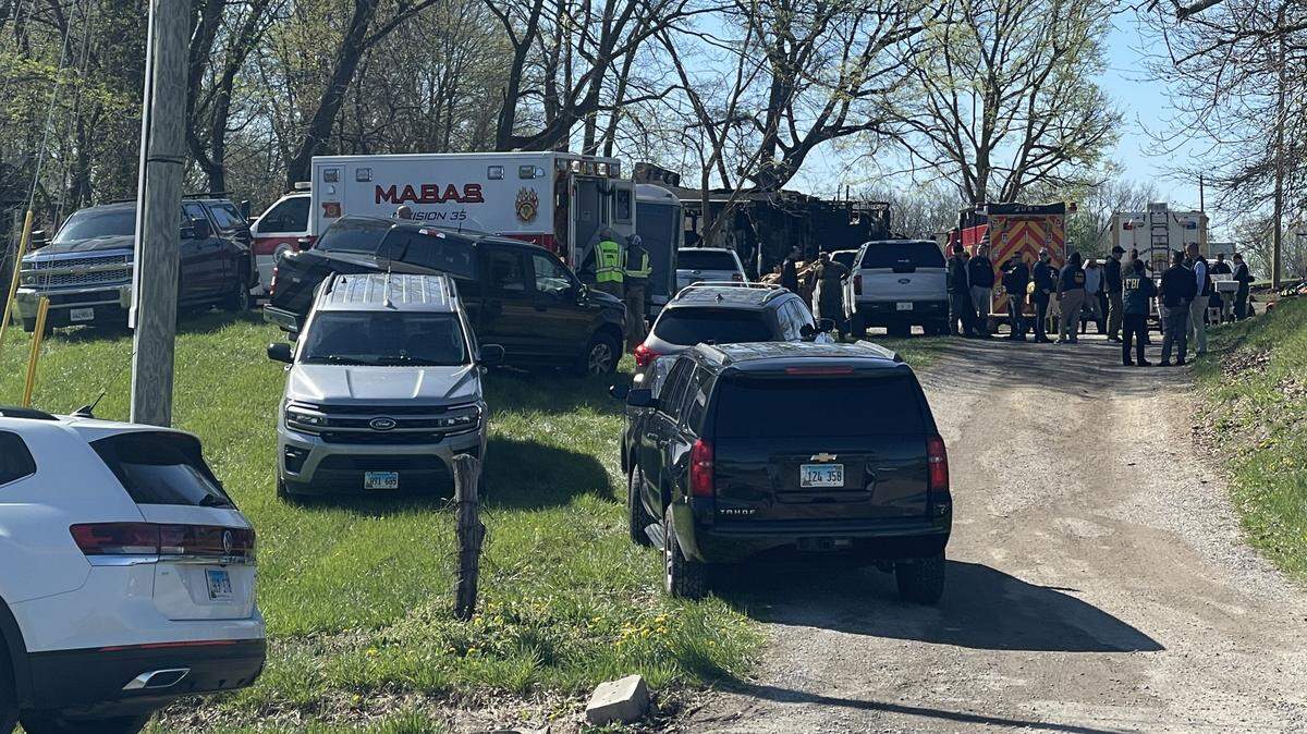 Law enforcement and public safety authorities gather at a home in the 8000 block of Kirsch Road near Troy after an explosion and fire led to the deaths of three Sunday night.