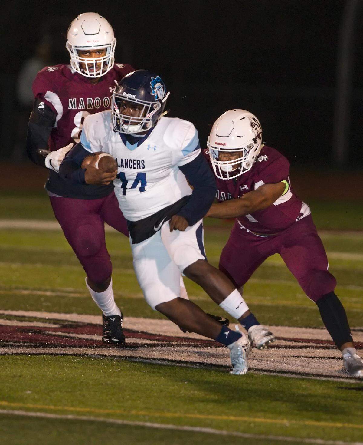 Belleville East quarterback Kienen Waller runs the ball during Friday’s game at Belleville West High School. Waller capped his high school career after starting under center three seasons for the Lancers.