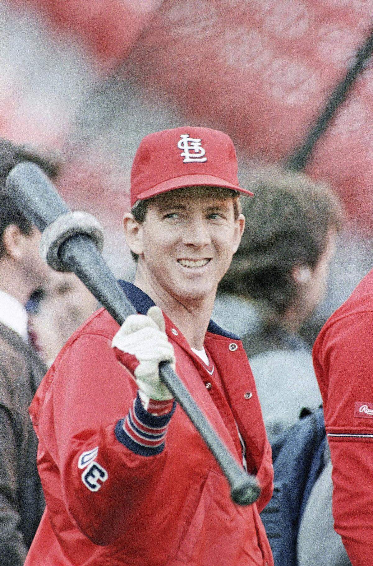 St. Louis Cardinals starting pitcher John Tudor is armed with a bat and a smile as he participates in batting practice at St. Louis Busch Stadium, Tuesday, Oct. 20, 1987, prior to the start of the third game of the World Series against the Minnesota Twins. (AP Photo/Rusty Kennedy)